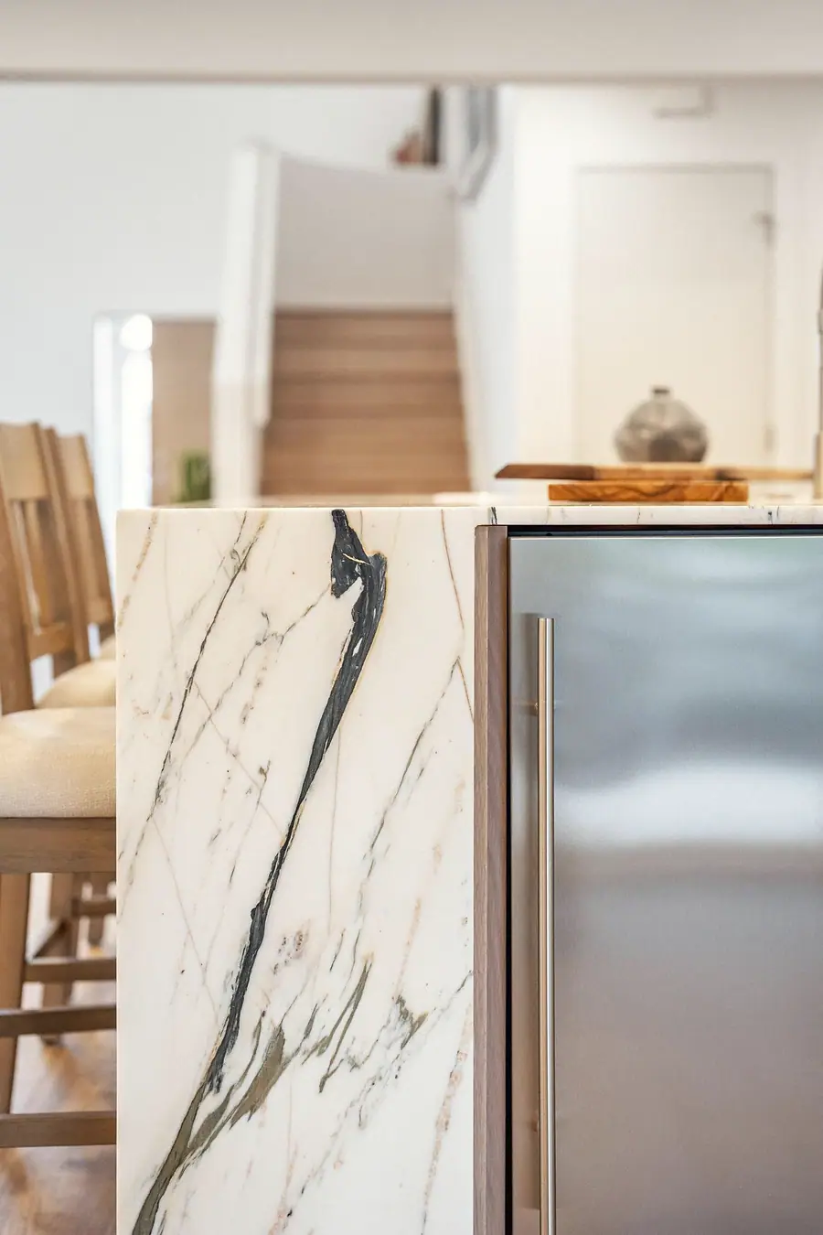 Grand Vista marble kitchen island detail beside a stainless appliance