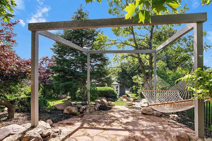 Wallace Project garden pergola with hammock and stone path