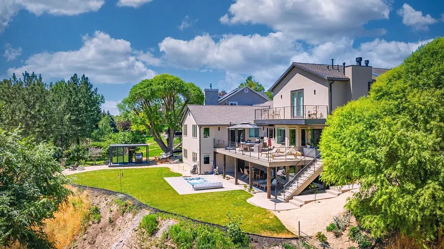 Elysium rear elevation with multi-level decks, lawn, and spa pavilion