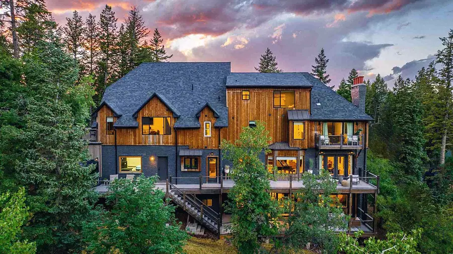Matterhorn Hygge House full rear elevation with terraced decks nestled in Summit Park forest
