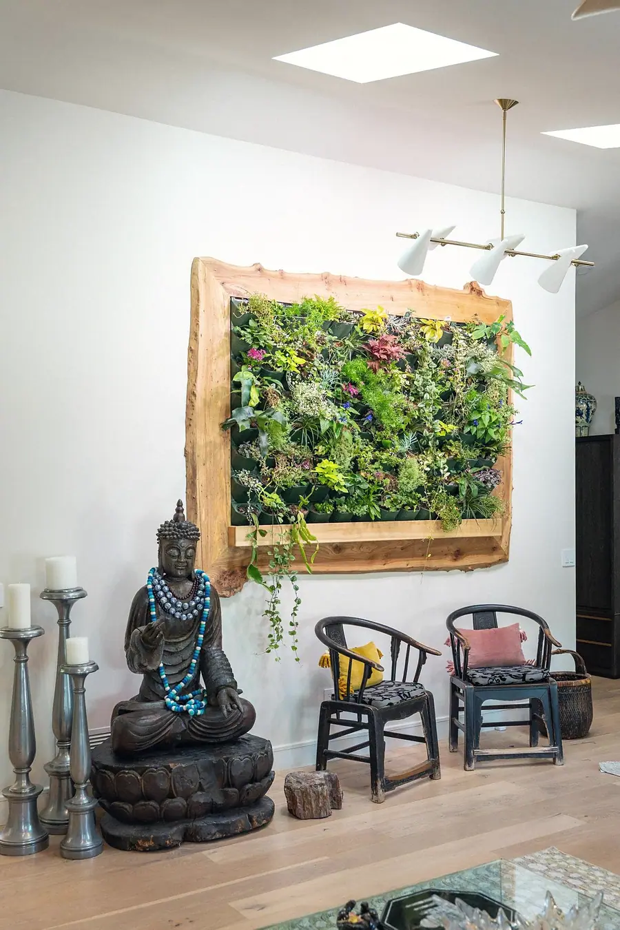 Elysium living plant wall in live-edge wood frame with Buddha sculpture