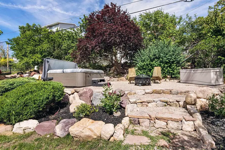Wallace Project backyard hot tub, fire pit, and rock garden