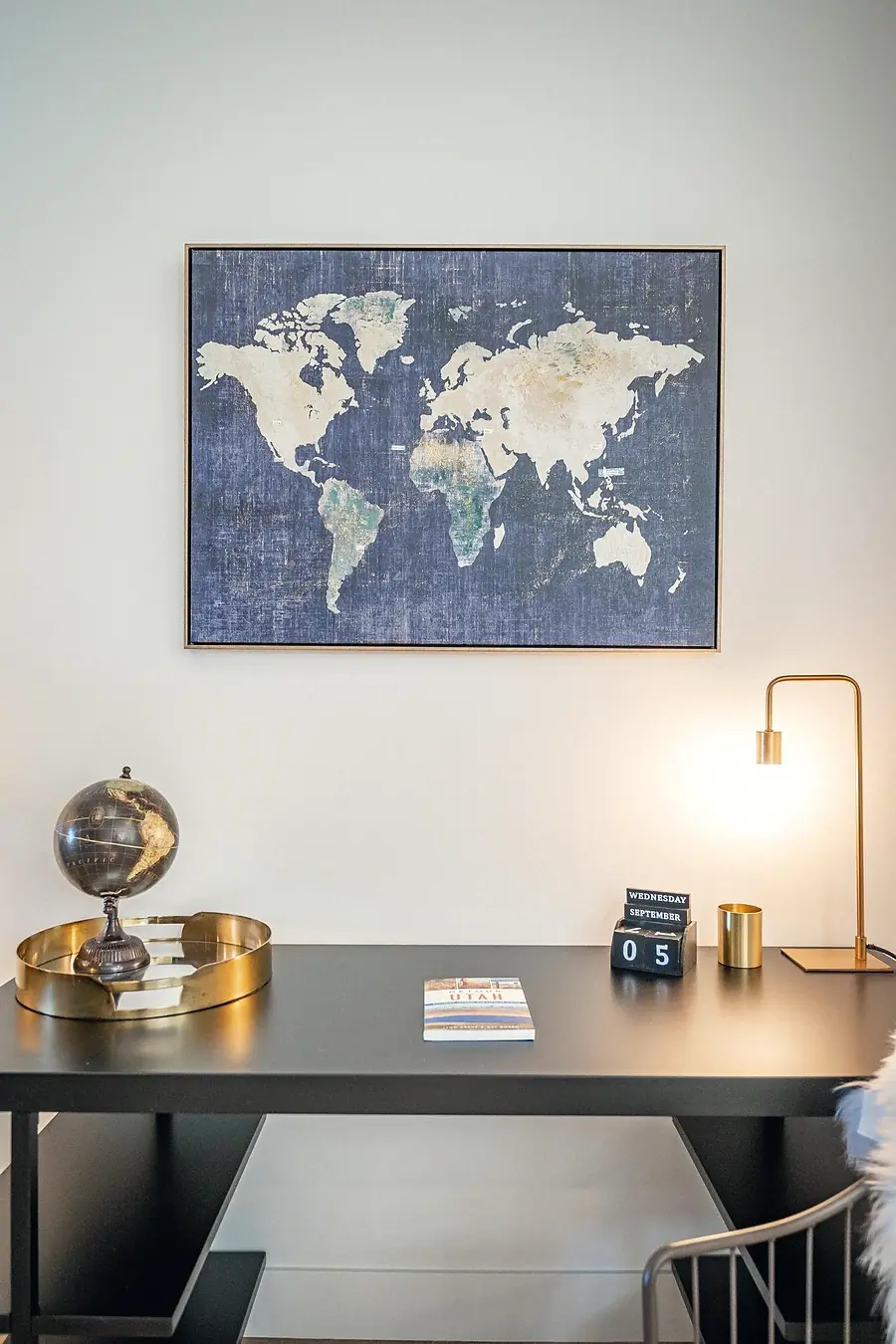 Silver Creek office desk with world map art, brass globe, and desk lamp