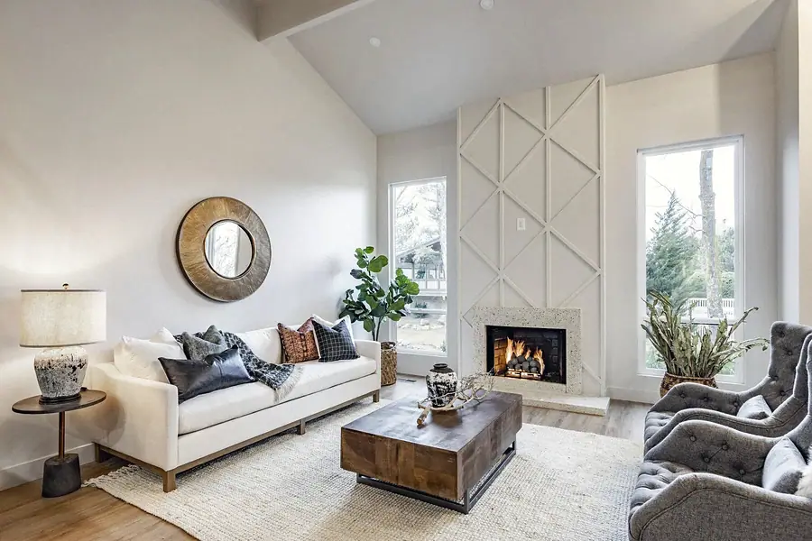 6468 S Brookstone living room with white sofa, gold mirror, and fireplace